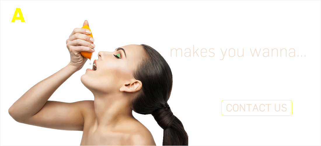 sexy woman squeezing a lemon's juice into her mouth